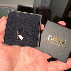 Catbird black and white cookie charm